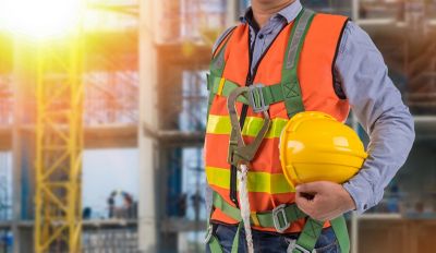 engineer wear fall arrest equipment on site  background